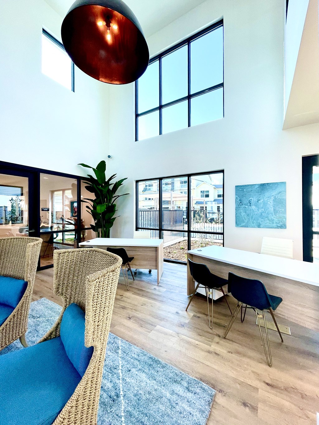 a dining room with a table and chairs and a large window