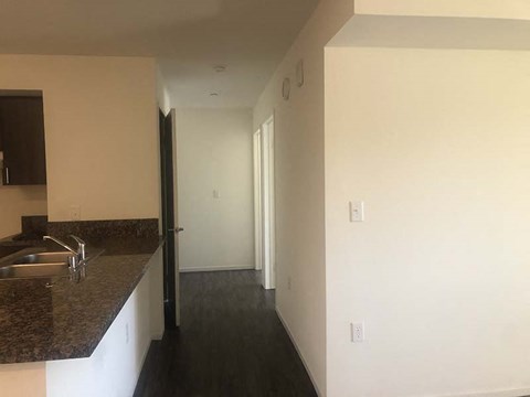 Interior view of kitchen and hallway