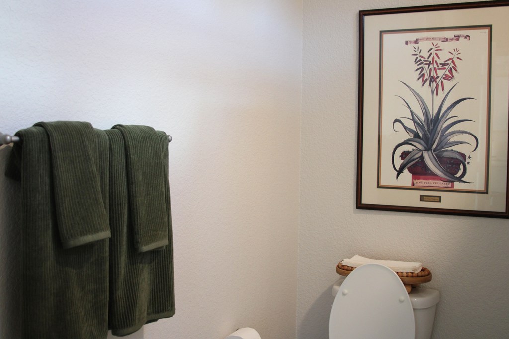 A towel is hanging on a towel rack in a bathroom.