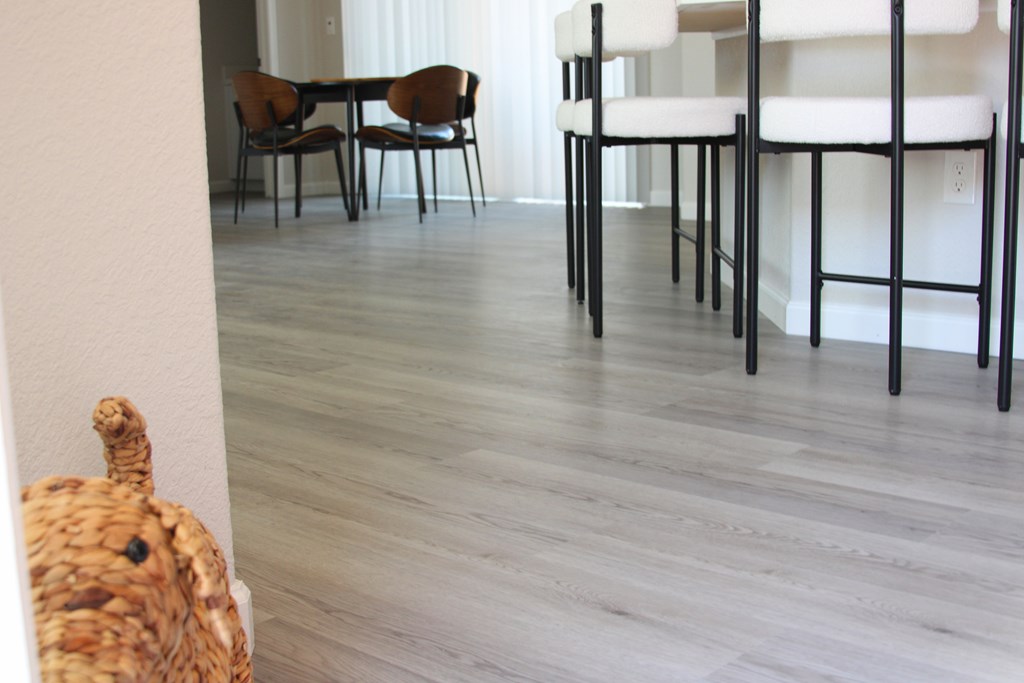 A room with a table and chairs.