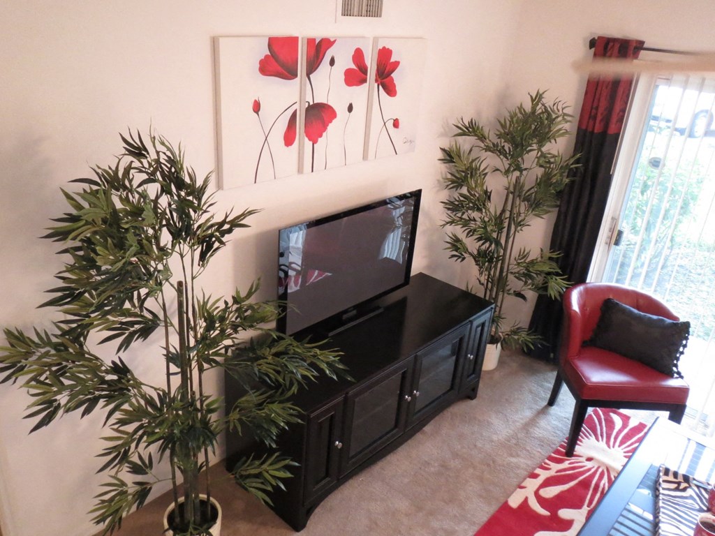 Monterey Pointe Apartments apartment home living area with balcony at Monterey Pointe, Florida