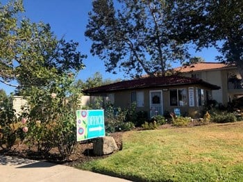 View of buildings and landscape with sign - Photo Gallery 4