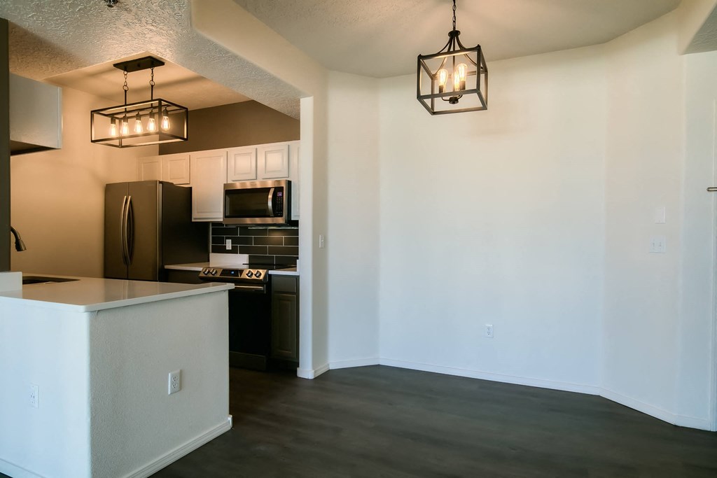 a kitchen and dining area in a 555 waverly unit