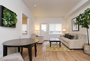 Apartments Arlington - Cedar Pointe - Open Dining Area with a Circular Table, Two Chairs, and Hardwood Style Vinyl Flooring - Photo Gallery 30