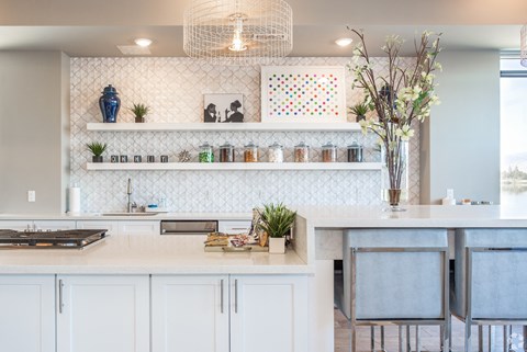a kitchen with white cabinets and a white counter top