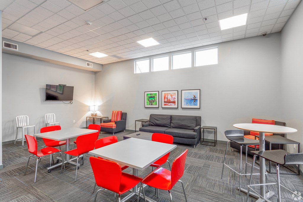 a room with tables and chairs and a couch