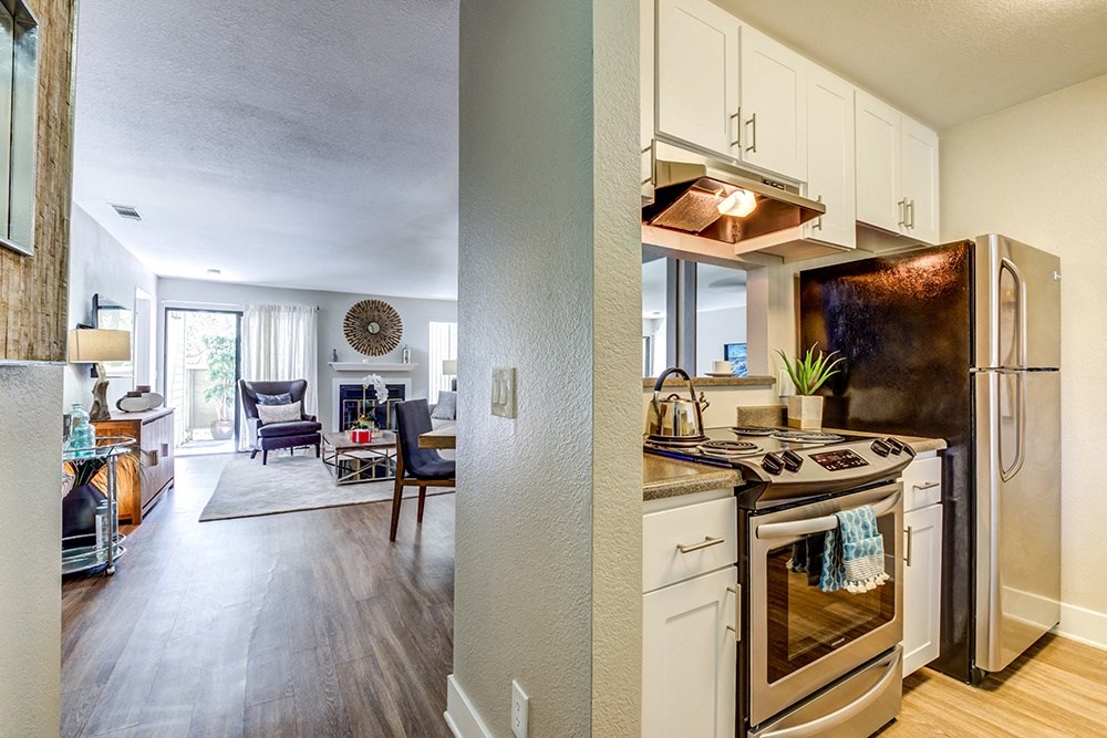Two Bedroom apartments in Pittsburg CA - Kirker Creek - Kitchen with Refrigerator, Stove, and Cabinets.