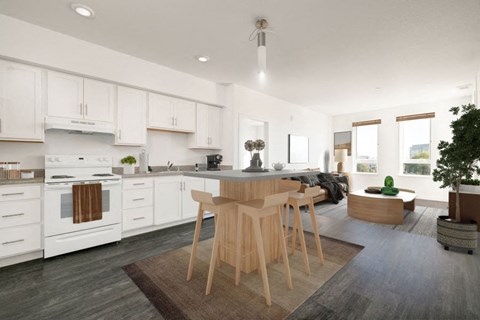 A modern kitchen with white cabinets and a central island.