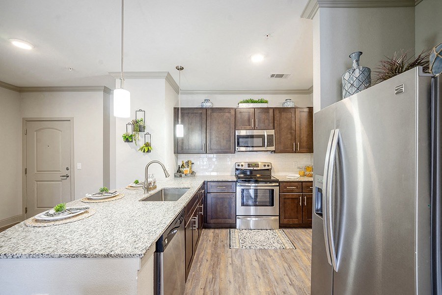 Full kitchen with stainless steel appliances and granite countertops