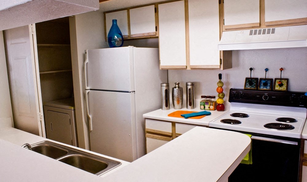 Kitchen with white cabinets and appliances