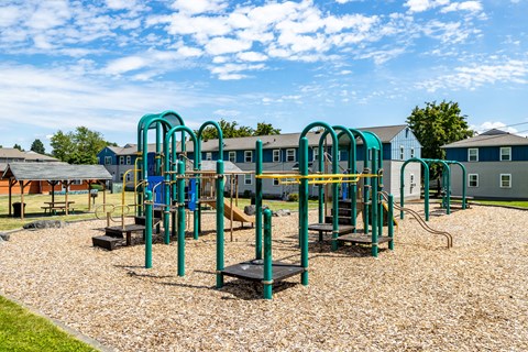 A playground with a slide, swings, and a seesaw.at Lake Washington Apartments, Seattle, 98118