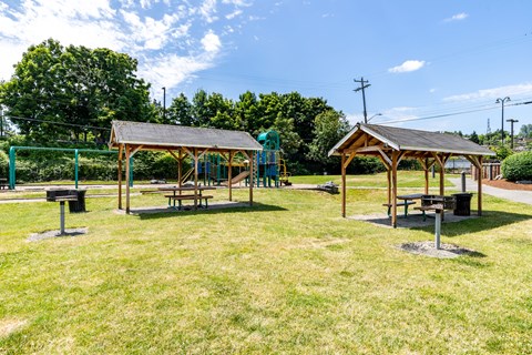 A park with picnic tables and pavilions at Lake Washington Apartments, Seattle Washington
