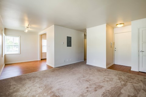 A spacious room with a carpeted floor and white walls.at Lake Washington Apartments, Seattle