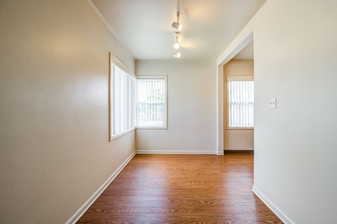 A room with wooden floors and white walls.at Lake Washington Apartments, Seattle, WA 98118