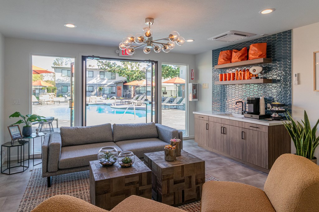 a living room with a couch and a coffee table and a pool