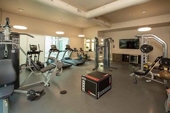 Fitness room with cardio and weight equipment at ALLURE AT 2920, Modesto, CA