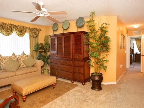 a living room with a couch and a dresser