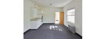 an empty room with a sink and a radiator at MILEPOST 5 Apartments, Oregon, 97213