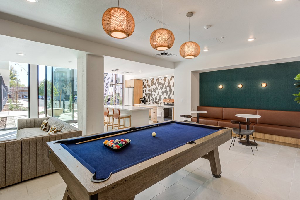 clubhouse with pool table at the preserve at great pond apartments in windsor tx
