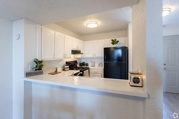 Kitchen with white cabinets and appliances - Photo Gallery 6
