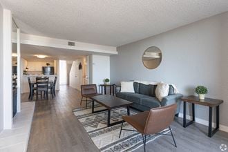 Living room with wood floors near dining area