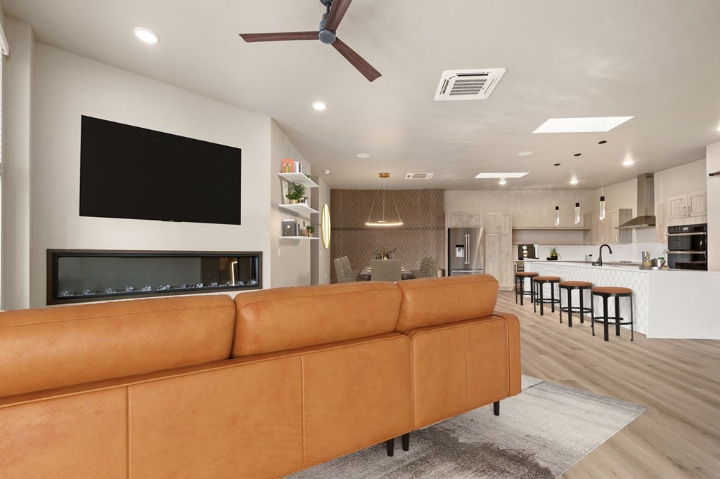 a living room filled with furniture and a flat screen tv