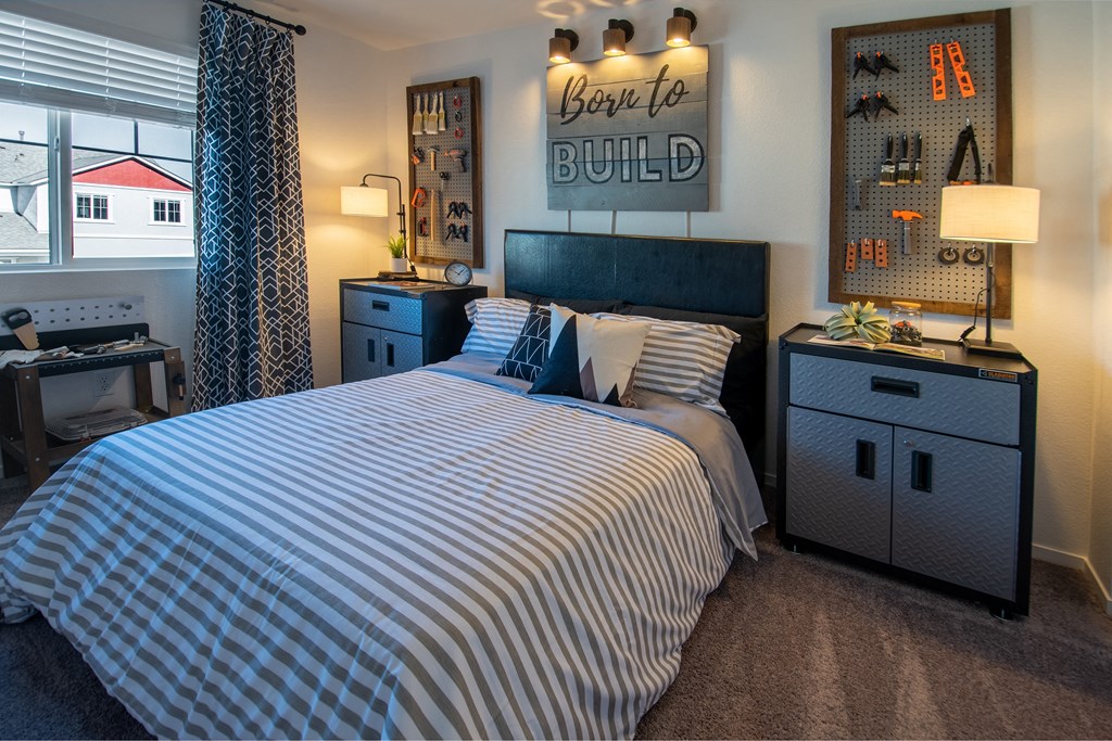 a bedroom with a bed and a dresser and a window