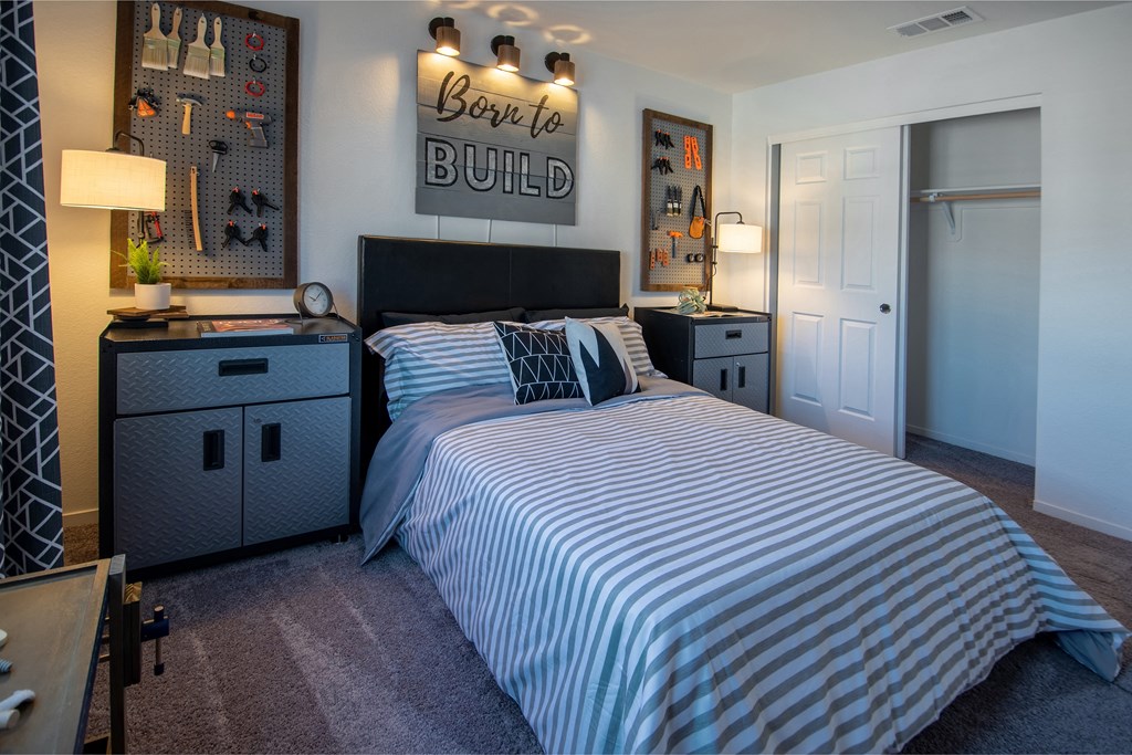 a bedroom with a bed and a desk