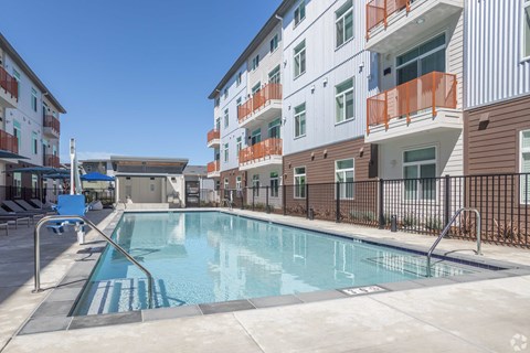 a swimming pool in front of a building
