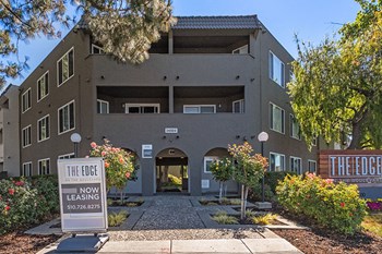 Entry walkway to building with sign
