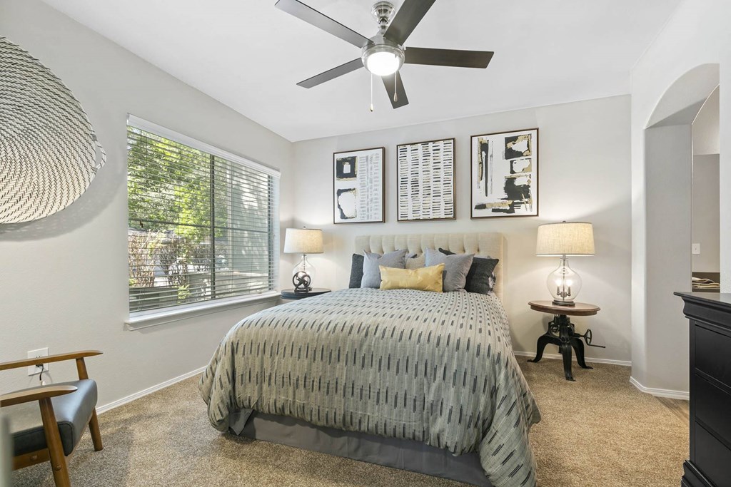 a bedroom with a bed and a ceiling fan at Ascent Apartments, Utah, 84121