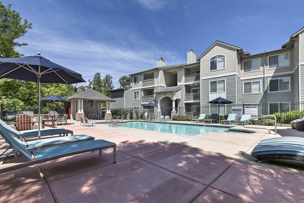 our apartments have a pool and lounge areas with umbrellas at Ascent Apartments, Utah