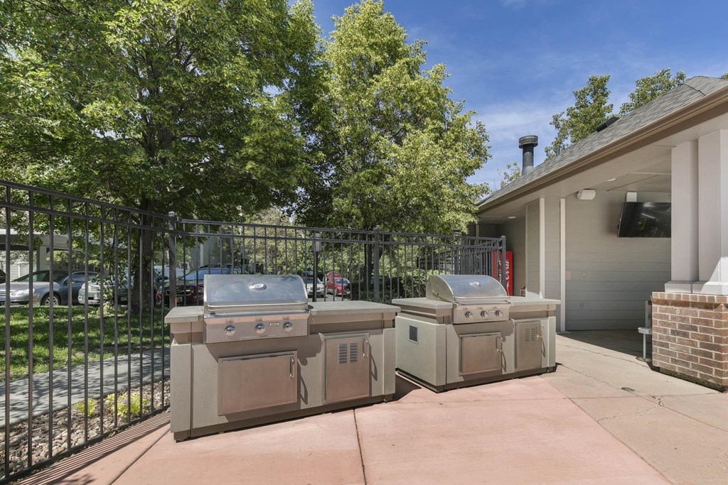 two bbqs on a patio in front of a house at Ascent Apartments, Cottonwood Heights