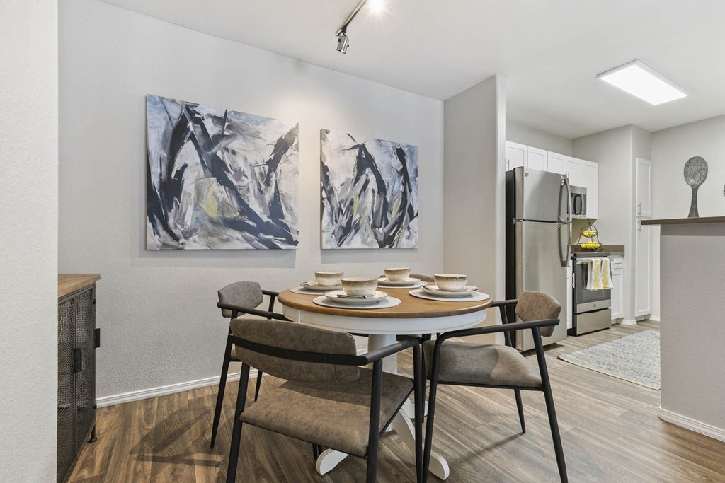 a dining room with a table and chairs at Ascent Apartments, Utah, 84121