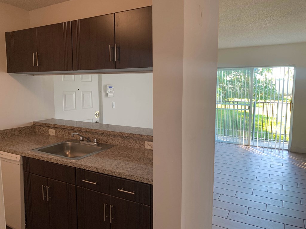 Kitchen with cabinets at Oaks at Pompano, Pompano Beach