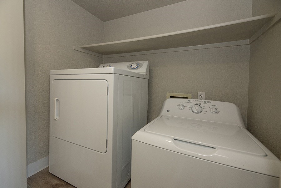 a laundry room with a washer and dryer