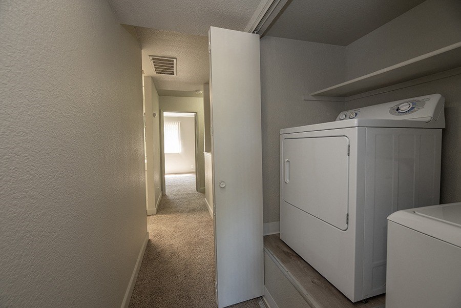a room with a washer and dryer in it