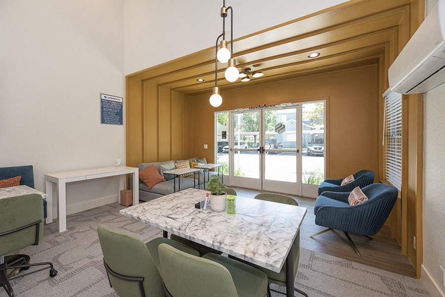 a large room with a table and chairs