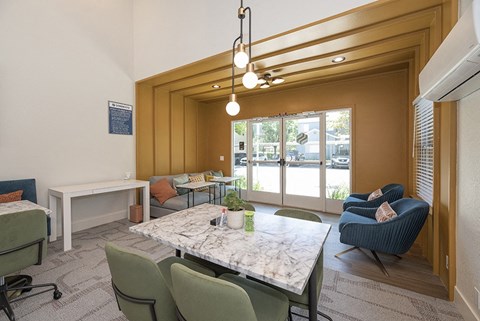 a large room with a table and chairs