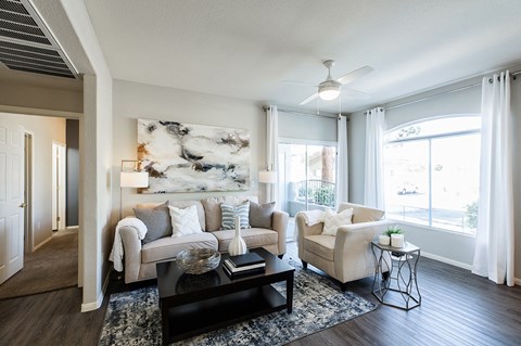 a living room with couches and a coffee table