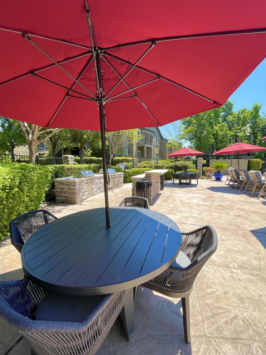 seating with chairs, fire pit and pool area