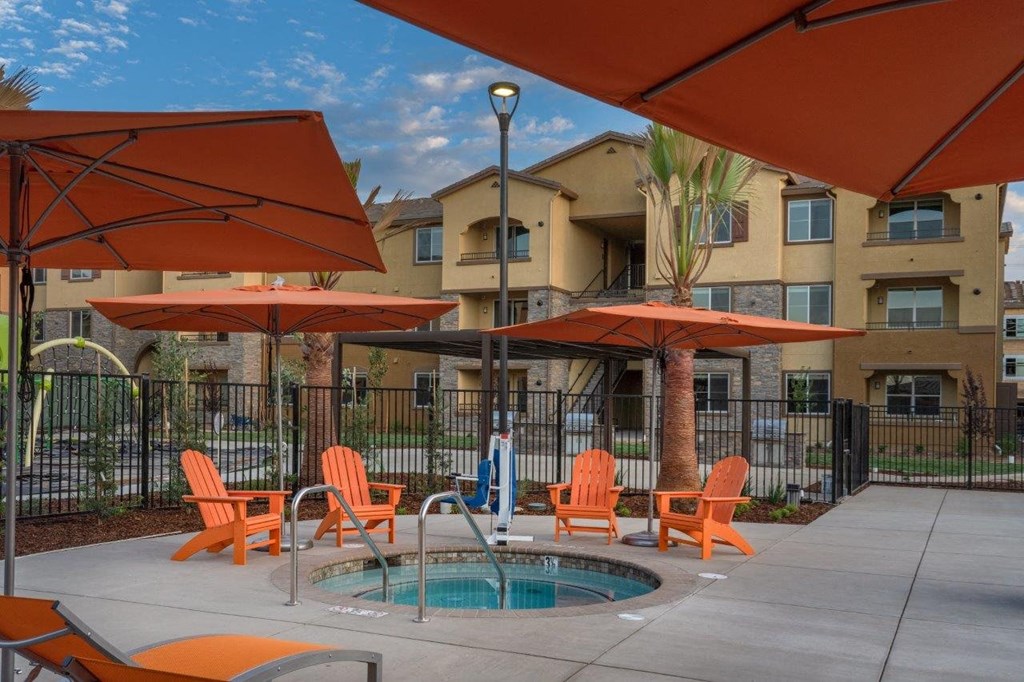 Apartments in Roseville for Rent - Harvest at Fiddyment Ranch - Jacuzzi Area with Seating and Umbrellas