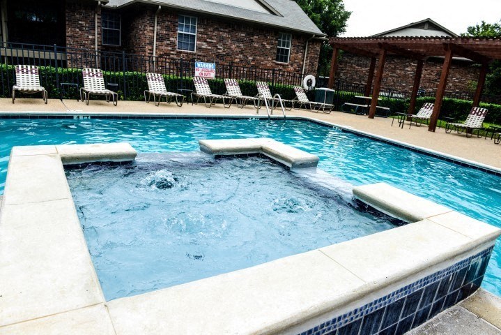 Pool and spa with seating