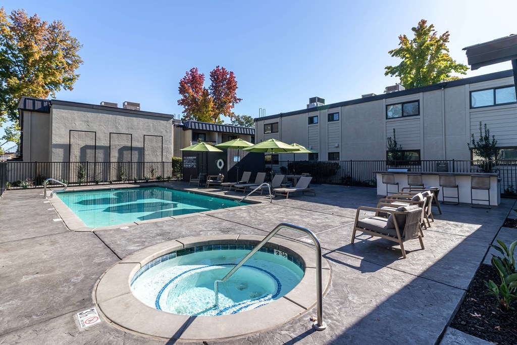 One BR Apartments in Carmichael CA - Terra Vida - Poolside Grill Area with BBQ and Bar-Style Seating.