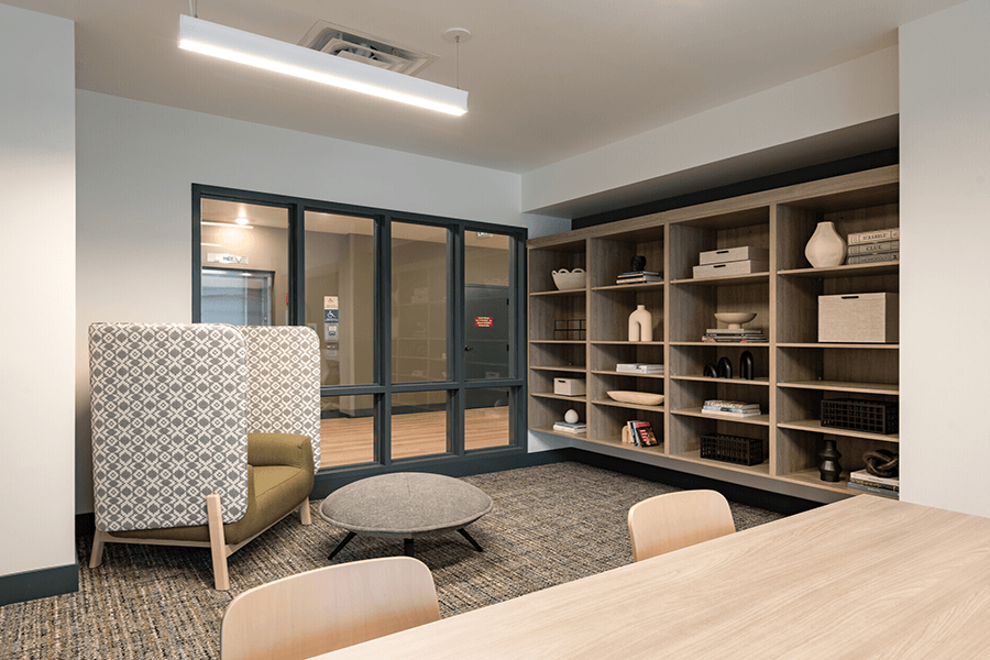 a room filled with furniture and a large window