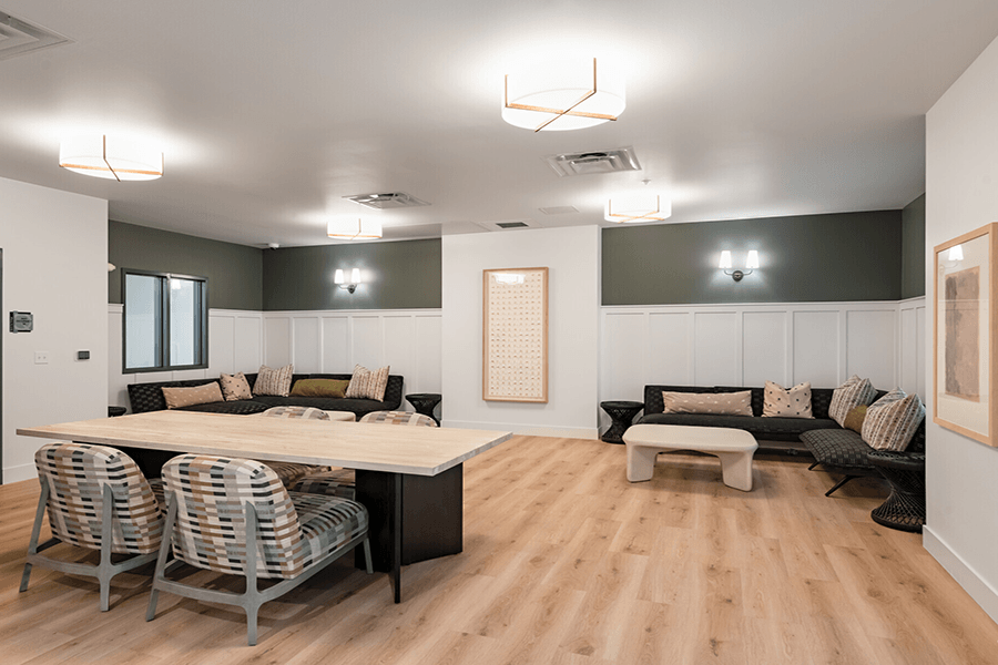 a meeting room with couches and a table