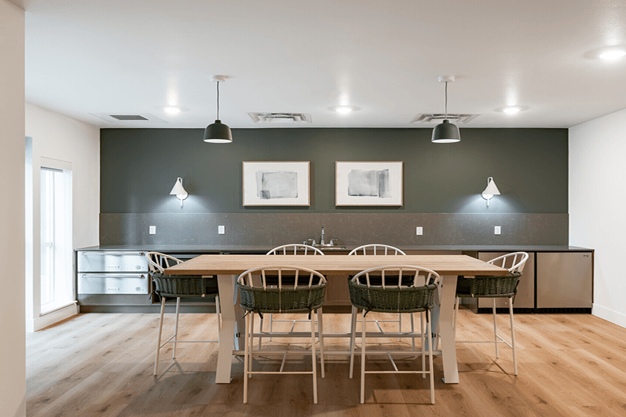 a conference room with a long wooden table and chairs
