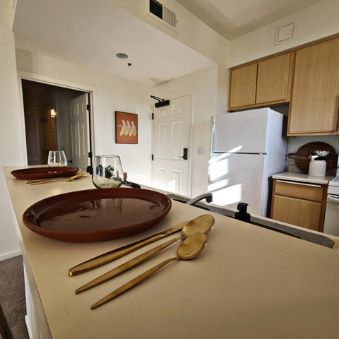 a kitchen with a plate and utensils on a counter