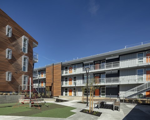 a view of the courtyard and balconies of an apartment complex at ROCKY HILL VETERANS HOUSING, VACAVILLE, CA