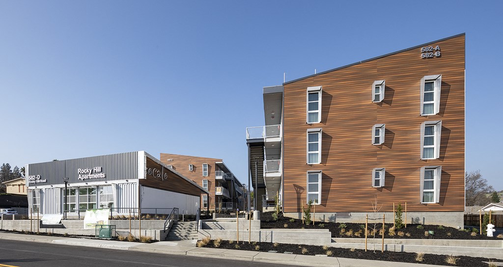 a large building with a wooden facade and a gray building next to it a large building with a wooden facade and a gray building next to it at ROCKY HILL VETERANS HOUSING, VACAVILLE California